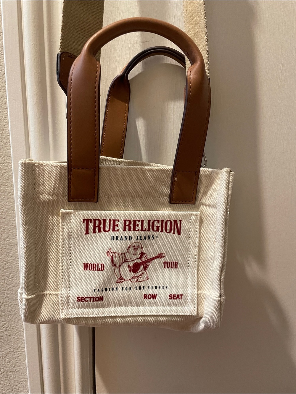 True Religion Cream Canvas Tote with Red Logo and Brown Handles